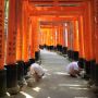 One more torii being cemented in place along the path.