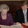 New king Willem-Alexander and now princes Beatrix looking at the signatures on the abdication papers